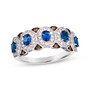 front view of blue sapphire white and brown diamond oval ring in 14k white gold