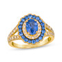 blue sapphire and champagne diamond oval halo ring in 14k yellow gold