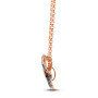 side view of blue and white sapphire butterfly pendant necklace in 14k rose gold