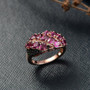 rhodolite garnet and black spinel cluster ring in 18k rose gold over sterling silver shown in a lifestyle photo