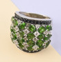 chrome diopside black spinel and white zircon wide cluster band ring in rhodium over sterling silver shown in a lifestyle photo