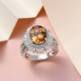 scapolite ethiopian opal and white zircon halo ring in rhodium over sterling silver shown in a lifestyle photo