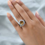 scapolite ethiopian opal and white zircon halo ring in rhodium over sterling silver worn on a hand
