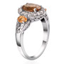 side view of scapolite fire opal and white zircon halo trilogy ring in rhodium over sterling silver