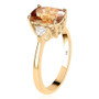 side view of honey scapolite and moissanite ring in 10k yellow gold
