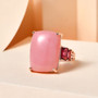 peruvian pink opal and rhodolite garnet cushion cocktail ring in 18k rose gold over sterling silver shown in a lifestyle photo