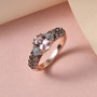 blush pink tourmaline brown and white zircon ring in 18k rose gold over sterling silver shown in a lifestyle photo