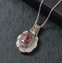 pink apatite champagne and white diamond halo necklace in 18k rose gold over sterling silver shown in a lifestyle photo
