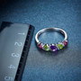 amethyst and peridot rhodolite band ring in rhodium over sterling silver