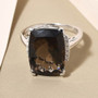 columbianite and diamond cushion solitaire ring in 18k white gold shown in a lifestyle photo