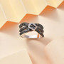 close up of multi-color diamond buckle crossover ring in rhodium over sterling silver