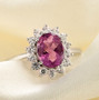 front view of pink fluorite and white zircon oval halo ring in rhodium over sterling silver