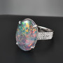 close up of australian boulder oval opal triplet and lab diamond ring in 10k white gold