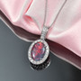 australian boulder opal triplet and lab diamond oval halo pendant necklace in 10k white gold shown in a lifestyle photo