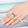 oval sapphire and white zircon band ring in rhodium over sterling silver worn on a hand