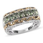 Studio image of green apatite two-tone ring stamped 925, featuring alternating gold and silver scrollwork and seven oval gemstones.