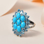 sleeping Beauty turquoise and blue topaz cocktail ring shown in artistic lighting