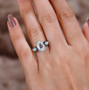 hyalite Opal and Ethiopian Opal ring worn on hand showing gemstone sparkle and color contrast