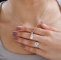 model wearing hyalite opal and white zircon ring and pendant necklace jewelry set