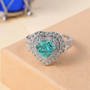 heart-shaped paraiba tourmaline surrounded by double diamond halo ring in 950 platinum on neutral background
