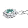 side profile of paraiba tourmaline pendant showing layered diamond halo and platinum bail