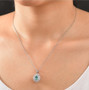 paraiba tourmaline and diamond oval double halo pendant necklace in 950 platinum worn around the neck
