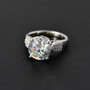 close up of strontium titanate and moissanite ring in rhodium over sterling silver