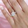 strontium titanate and moissanite ring shown on hand 18k yellow gold over sterling silver