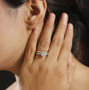 120 facet strontium titanate moissanite and sapphire bridal set in 18k yellow gold over sterling silver shown being worn