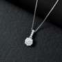 120 facet strontium titanate and moissanite pendant necklace on black background rhodium over sterling silver