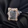 indian alexandrite and white zircon fleur-de-lis cluster ring in 18k yellow gold and rhodium over sterling silver shown in a lifestyle photo