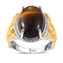 oval tigers eye cabochon ring with elephant shank in two tone 18k yellow gold and rhodium over sterling silver