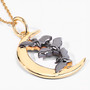 close up of bat and crescent moon pendant necklace in 18k yellow gold and black rhodium over sterling silver