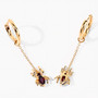 side view of garnet spider dangle earrings in 18k yellow gold over sterling silver