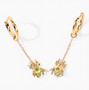 side view of peridot spider dangle earrings in 18k yellow gold over sterling silver