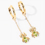 angled view of peridot spider dangle earrings in 18k yellow gold over sterling silver