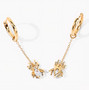 open view of sky blue topaz spider dangle earrings in 18k yellow gold over sterling silver