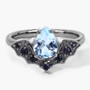 front view of aquamarine and black spinel bat ring in black rhodium over sterling silver