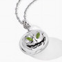 side view of 3d pumpkin peridot pendant highlighting curved form silver stem and gemstone eyes under rhodium finish
