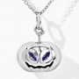front view of 3d pumpkin pendant with vivid blue violet tanzanite eyes crafted in rhodium plated sterling silver with mirror shine finish