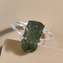 angled view of moldavite rough solitaire ring in rhodium over sterling silver