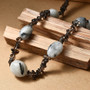angled view of tourmalinated and smoky quartz tumble and chip necklace in rhodium over sterling silver 18-20"