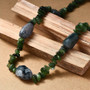 angled view of moss agate and nephrite jade tumble and chip necklace in rhodium over sterling silver 18-20"