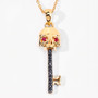 key pendant with black spinel and ruby eyes in 18k yellow gold over sterling silver