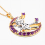 side view of flying witch and crescent moon two-tone pendant necklace with amethyst and white topaz in 18k yellow gold and rhodium over sterling silver