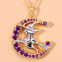 close up of flying witch and crescent moon two-tone pendant necklace with amethyst and white topaz in 18k yellow gold and rhodium over sterling silver