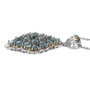 angled view of cats eye cabochon alexandrite cluster pendant necklace in two-tone 18k yellow gold and rhodium over sterling silver