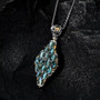 close up of cats eye alexandrite cluster pendant necklace in two-tone 18k yellow gold and rhodium over sterling silver