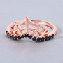 close up of chevron spider web ring with sapphire in 18k rose gold over sterling silver