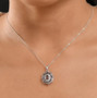 color change garnet and white zircon deco inspired halo pendant necklace in rhodium over sterling silver shown for size comparison